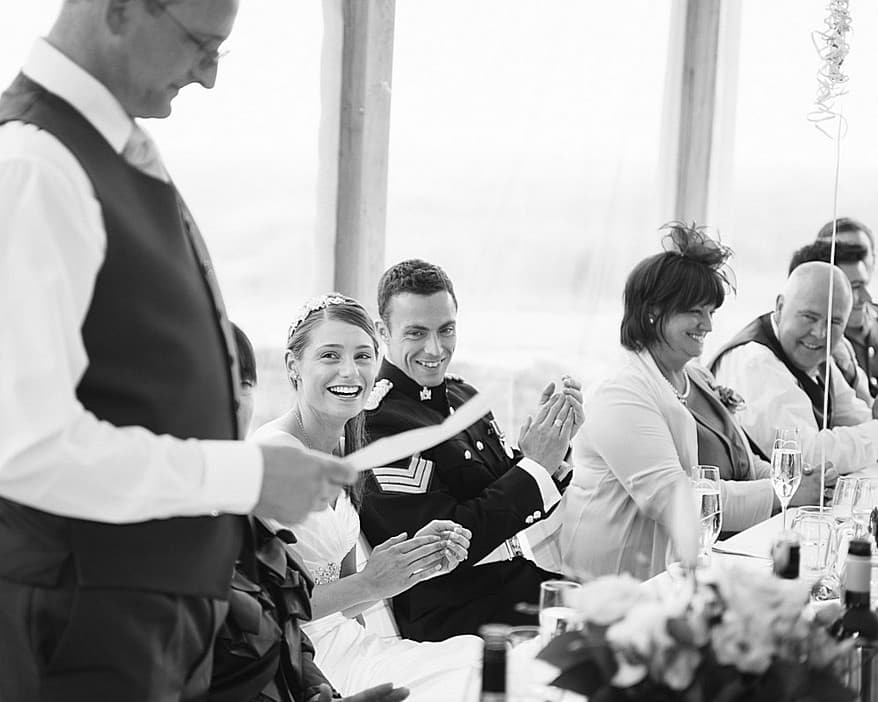 Trevenna barns head table with bride laughing
