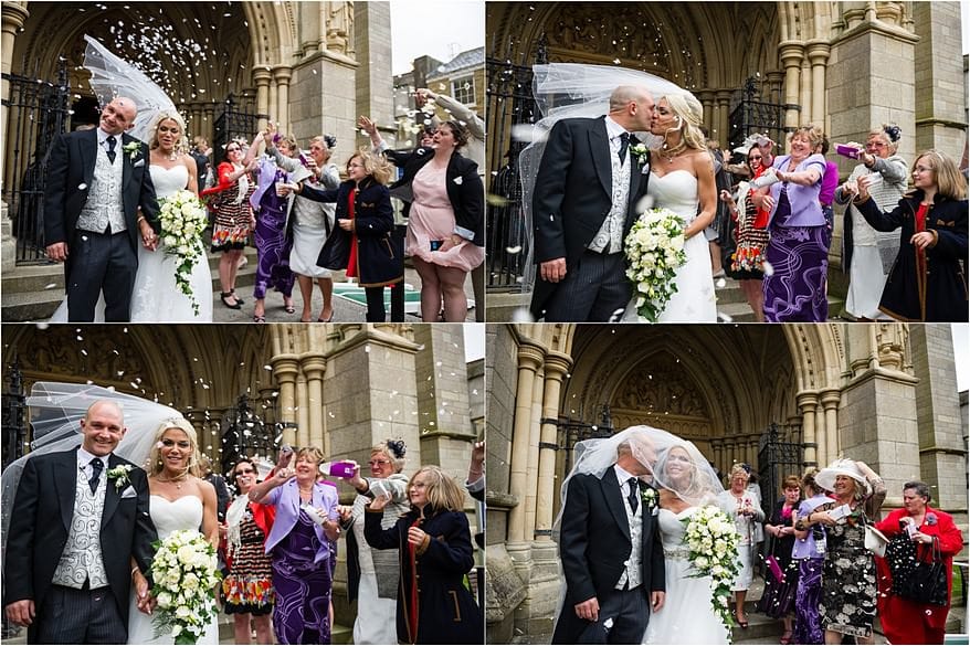 Brides Veil blowing while the confetti being thrown at Truro Cathedral