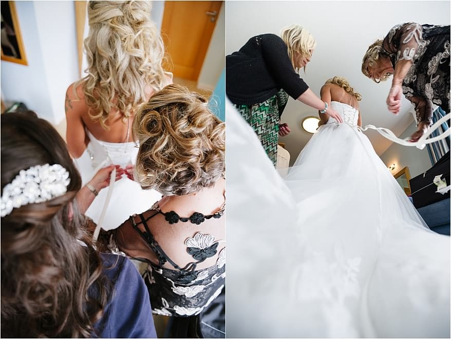 Bride getting her dress on in the honeymoon suite at St Michael's Hotel
