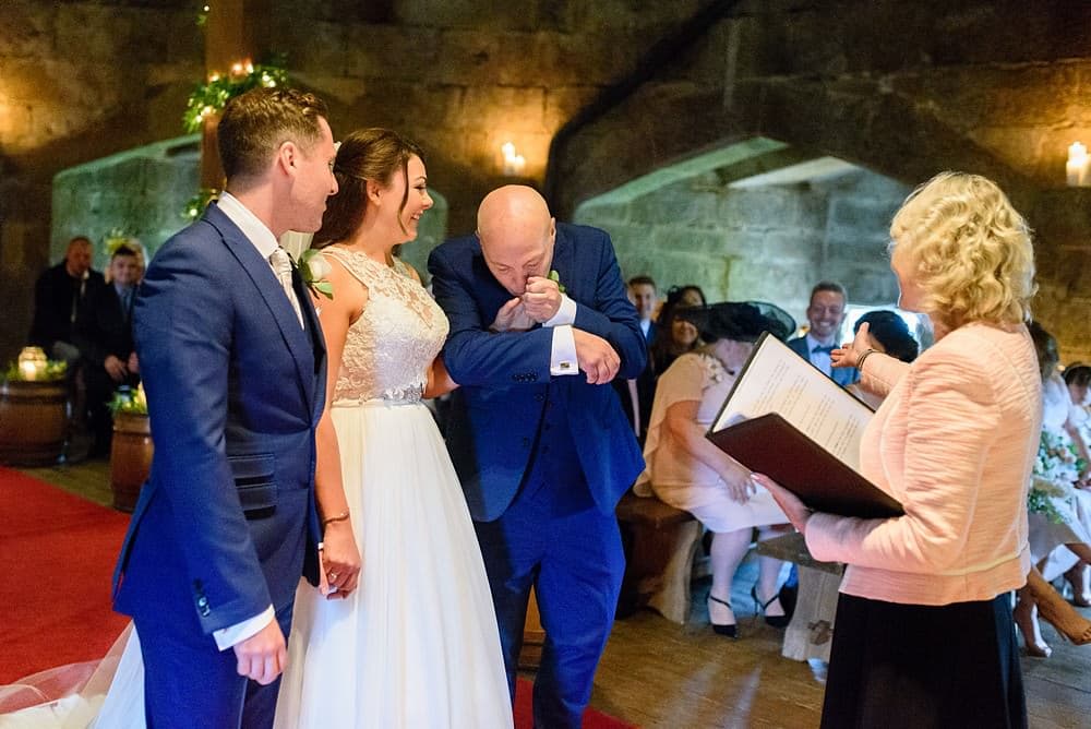 dad kissing bride at a Pendennis Castle wedding