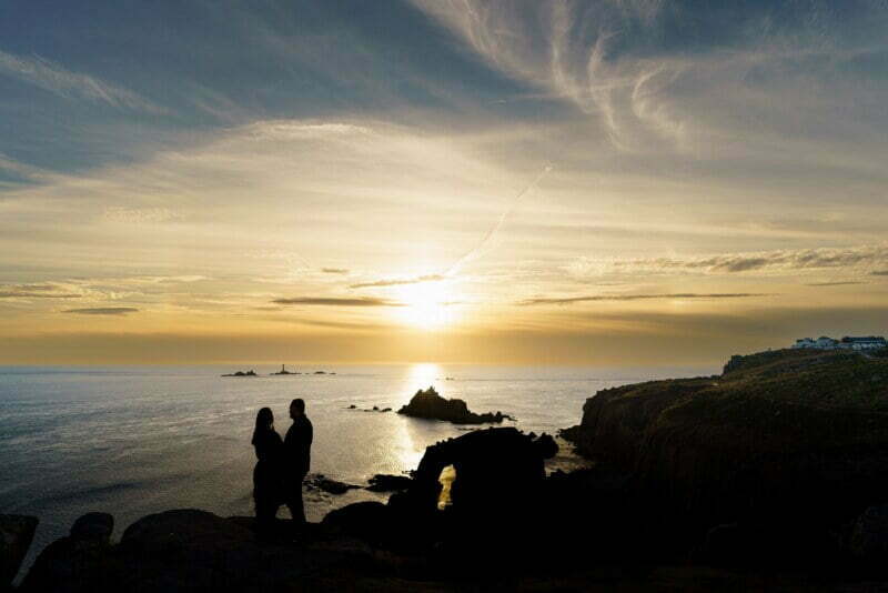 sunset engagement shoot at Enys Dodnan Arch 