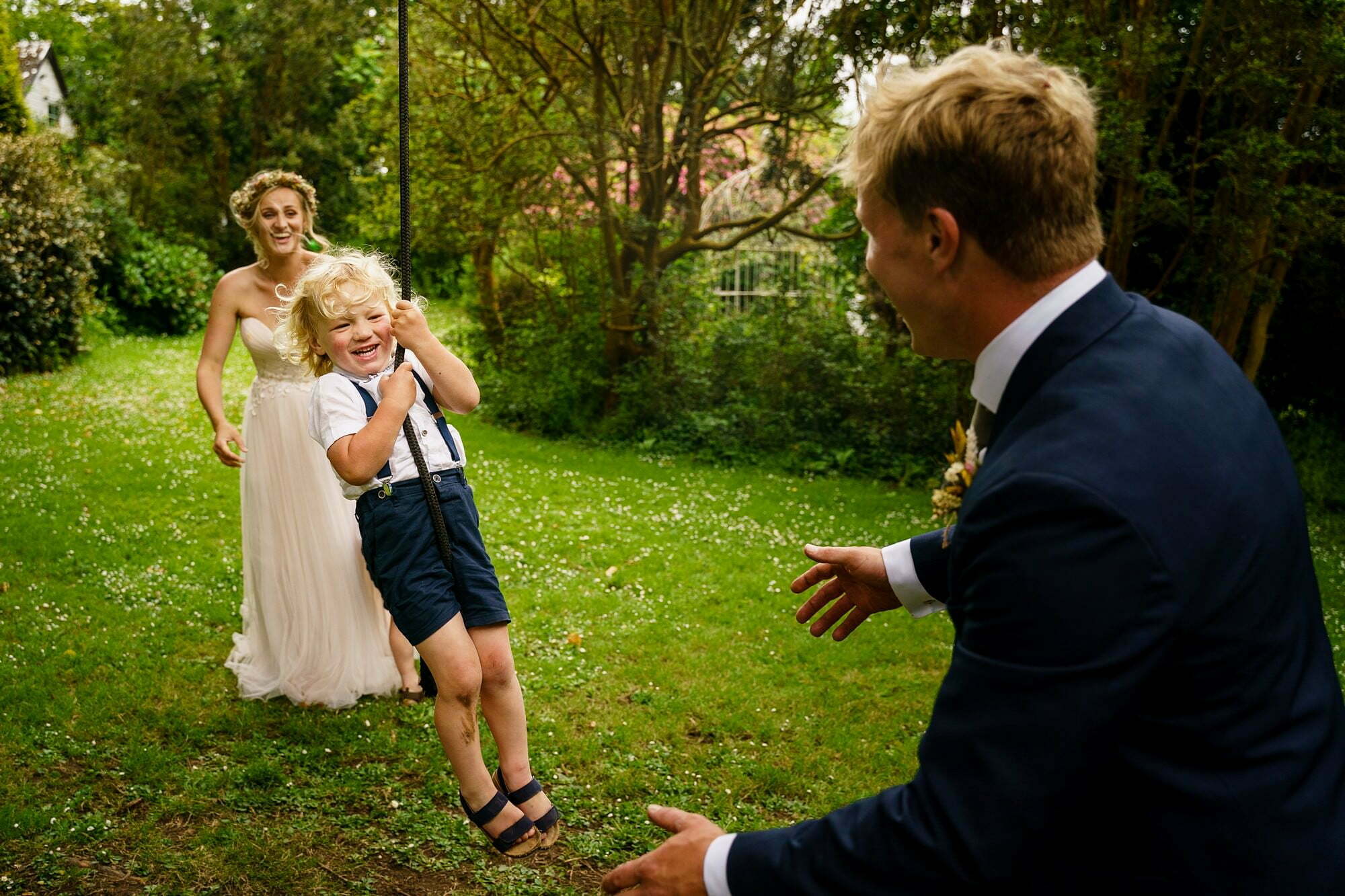 Cornish Camels Wedding Photographer 40 kids enjoying the rope swing at cornish camels