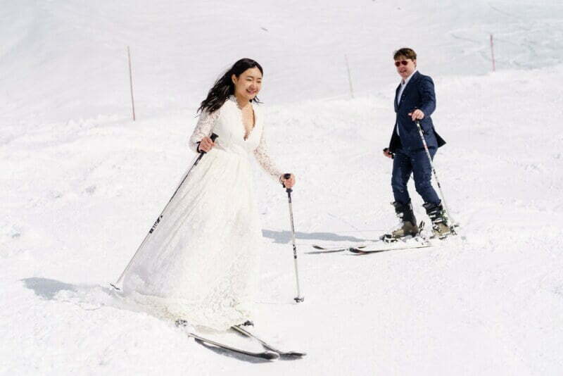 bride skiing in her wedding dress in france