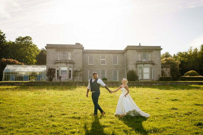 bride and groom on the lawn at scorrier house