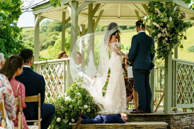 Wedding ceremony under the summerhouse at Pengenna